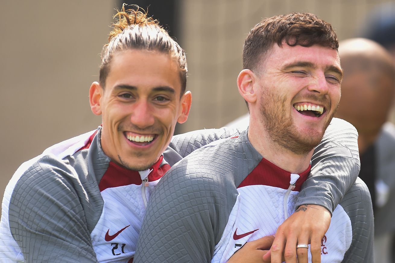 Kostas Tsimikas and Andy Robertson of Liverpool during a training session at AXA Training Centre on May 23, 2023 in Kirkby, England.