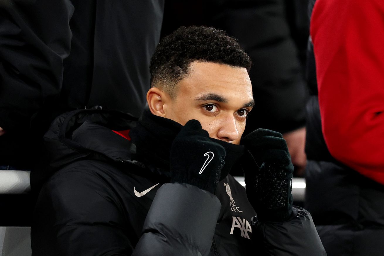  Trent Alexander-Arnold of Liverpool looks on from the substitutes bench during the Carabao Cup Semi Final Second Leg match between Liverpool and Tottenham Hotspur at Anfield on February 06, 2025 in Liverpool, England.