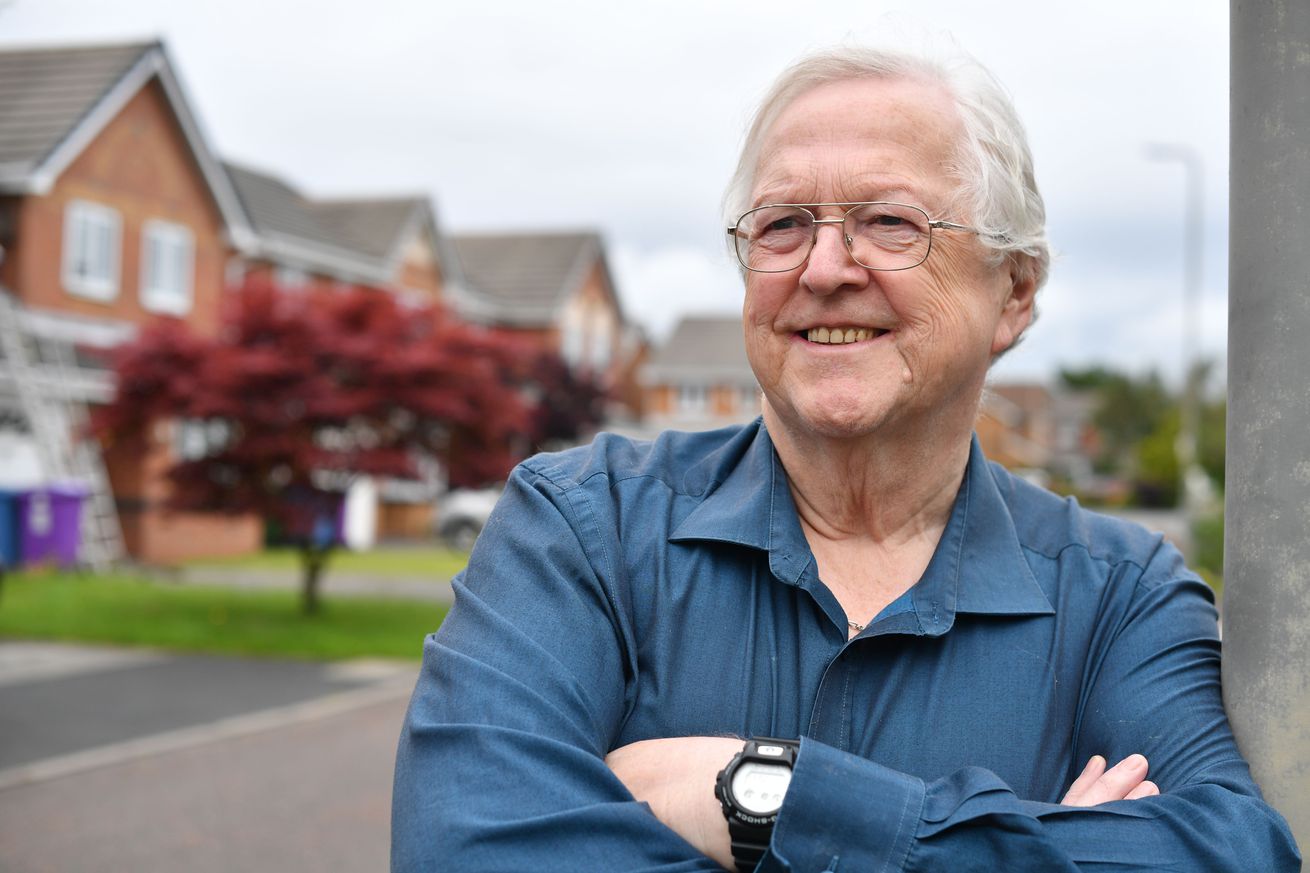 Anfield stadium announcer, George Sephton, 74, the Voice of Anfield, poses for a photograph in Liverpool on July 13, 2020. - Known as the ‘Voice of Anfield’ Sephton has been a mainstay at Anfield
