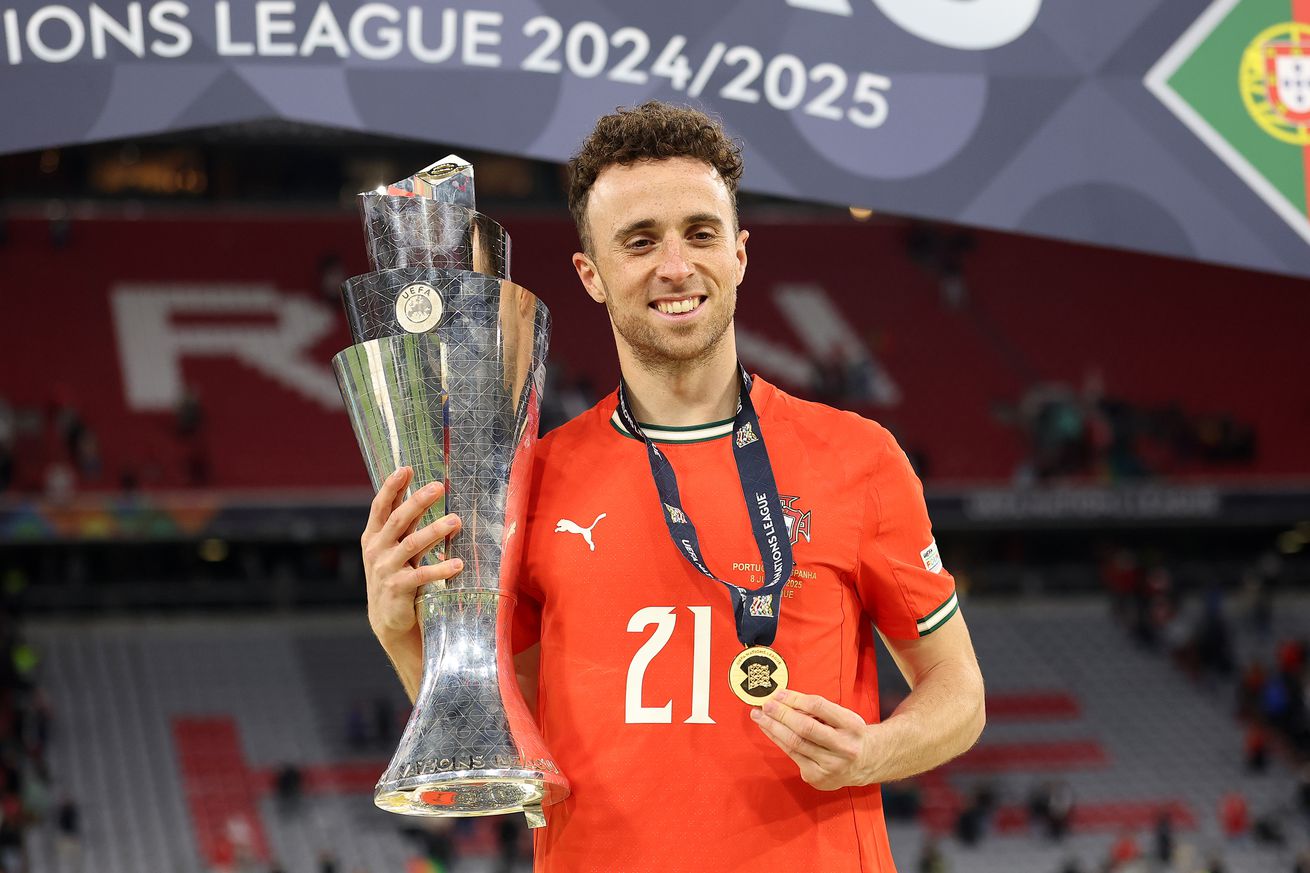 Diogo Jota of Portugal poses for a photograph with the UEFA Nations League trophy after his team’s victory in the UEFA Nations League 2025 final match between Portugal and Spain at Munich Football Arena on June 08, 2025 in Munich, Germany.